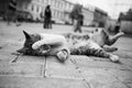 Black and white cat photo lying in the street in various funny poses