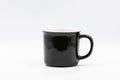 Black and white ceramic mug standing on white background Royalty Free Stock Photo