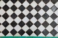 Black and white ceramic tiles in grid pattern