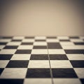 A black and white checkered floor with alternating square tiles. The surface appears Royalty Free Stock Photo