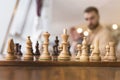 Black and white chess figures on a chessboard, closeup. Set of chess figures on the playing board Royalty Free Stock Photo