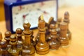 Black and white chess pieces on a chessboard, closeup. Set of chess figures on the playing board Royalty Free Stock Photo