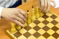 Black and white chess pieces on a chessboard, closeup. Set of chess figures on the playing board Royalty Free Stock Photo