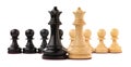 Black and white chess queens in front of pawns on white background. Competition concept Royalty Free Stock Photo