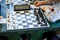 Black and white chessboard in the classroom on the table. Lesson, training, intellectual game