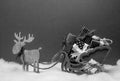 Black white christmas deer with sledges and presents festive mood