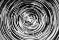 Black and white circular blur in the form of a whirl background texture, radial blur, abstract twist, funnel