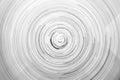 Black and white circular blur in the form of a whirl background texture, radial blur, abstract twist, funnel