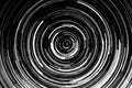 Black and white circular blur in the form of a whirl background texture, radial blur, abstract twist, funnel