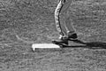 Black and white of close up of baseball base and players pants a Royalty Free Stock Photo