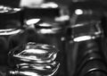 Black and white close-up image of whiskey Old Fashioned or Rocks glasses along with shot or shooter glasses on a dish drainer in t Royalty Free Stock Photo