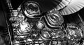 Black and white close-up image of whiskey Old Fashioned or Rocks glasses along with shot or shooter glasses on a dish drainer in t Royalty Free Stock Photo