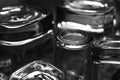 Black and white close-up image of whiskey Old Fashioned or Rocks glasses along with shot or shooter glasses on a dish drainer in t Royalty Free Stock Photo