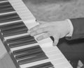 Black and white, Close up of woman hand playing piano Royalty Free Stock Photo