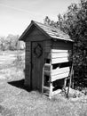 Black and white closeup of the outhouse for the J.R. Cummins historical homestead located in Eden Prairie, MN - June 10, 2019 Royalty Free Stock Photo