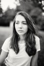 Black-and-white closeup portrait of pensive thinking dreaming young beautiful Caucasian woman girl with messy hair Royalty Free Stock Photo