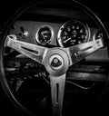 A closeup of a vintage steering wheel