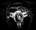 A closeup of a vintage steering wheel