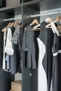 Black and white clothes hanging in closet Royalty Free Stock Photo