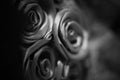 Black and white concept, texture of silk fabric in black color folded in the form of a rose Royalty Free Stock Photo