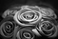 Black and white concept, texture of silk fabric in black color folded in the form of a rose Royalty Free Stock Photo