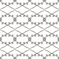 Black and white contrasting openwork seamless pattern of rhombuses and curls retro vector background