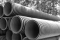 Black and white. Corrugated water pipes of large diameter prepared for laying Royalty Free Stock Photo
