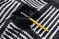 Black and white crocheted texture - closeup image of a handmade bag crocheted from black and white macrame cord, metal crochet