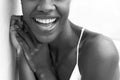 Black and white cropped portrait of african american woman smiling