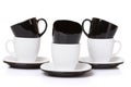 Black on white cups with stack plates. Royalty Free Stock Photo