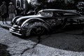 Black and White Custom Limo lowered onto the ground