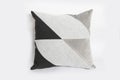 Black decorative pillow isolated on a white background. Royalty Free Stock Photo