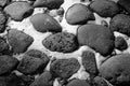 Black and white depressive background of cobblestones and snow Royalty Free Stock Photo