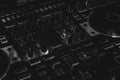 Black & White DJ Controller mixer section for mobile DJs with buttons & knobs blurred sliders