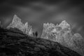 Black and white dolomite panorama with lonely mountaineer in silhouette