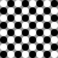 Black and white dots on gray backfround. optical illusion Royalty Free Stock Photo