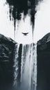 Black and white drone hovering over dramatic waterfall scene Royalty Free Stock Photo