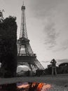 Black and white Eiffel Tower with Parisian colour in the water