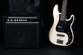 Black and white electric bass guitar with amplifier, jack cable, Royalty Free Stock Photo