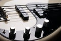 Black and white electric bass guitar close up Royalty Free Stock Photo