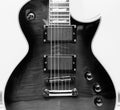 Black and White Electric Guitar with Humbucker Pickups Royalty Free Stock Photo