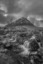 Black and white Epic majestic Winter sunset landscape of Stob Dearg Buachaille Etive Mor iconic peak in Scottish Highlands with