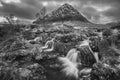 Black and white Epic majestic Winter sunset landscape of Stob Dearg Buachaille Etive Mor iconic peak in Scottish Highlands with