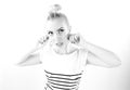 Black and white expressive portrait of a young stylish woman wearing stripes in the studio