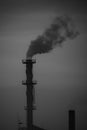 Black & white The factory released smoke chimney in sunset. Global warming concept Royalty Free Stock Photo