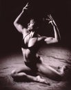 Black and white film image of a female bodybuilder