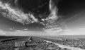 Black and white fine art picture of cut and baled alfalfa field under cirrus clouds in the Central Valley of California USA Royalty Free Stock Photo