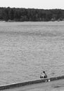 Black & white fisherman on river bank background Royalty Free Stock Photo