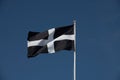 Black and white flag of St Piran patron saint of Cornwall