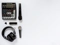 Black and white flat lay composition with microphones, headphones, mixing console, harmonica and picks. Top view of Royalty Free Stock Photo